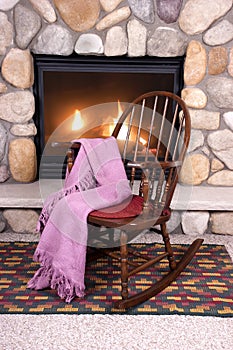 Wood Rocking Chair in Front of Home Fireplace