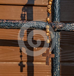 Wood rosary on a iron photo