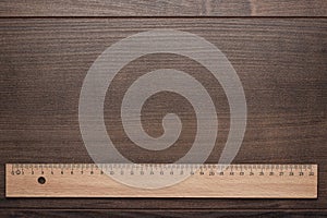 Wood ruler on the wooden background