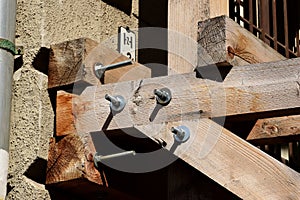 Wood scaffolding joint and bolted connection closeup. textured wood beams