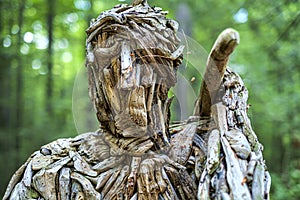 Wood sculpture head  details of a lumberjack in the Parc regional de la riviere du nord