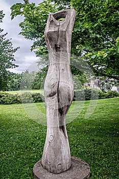 Wood Sculpture Woman seduction back view photo