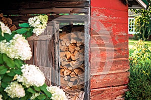 Wood shed stocked and ready for winter at a farm house