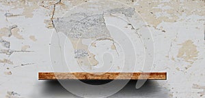 Wood shelf on brick wall. Polished cement floor. texture background. furniture.photo