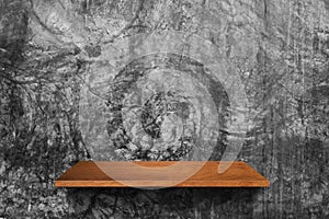 Wood shelf on cement wall background