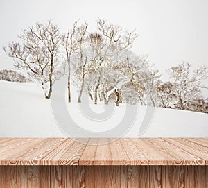 Wood shelf table with blurred background of winter time