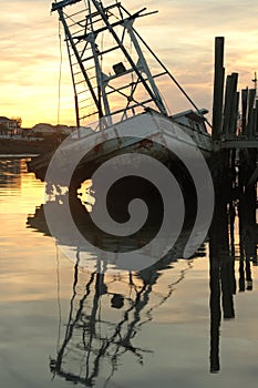 Wood shrimp boat graveyard sunset
