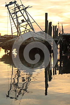 Wood shrimp boat graveyard sunset