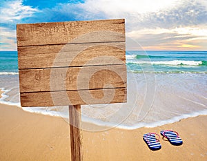 Wood sign on beach