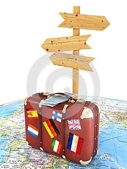 Wood sign board and old suitcase with striples flags on blurred world map