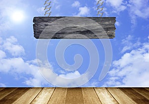 Wood sign on clouds in the blue sky background