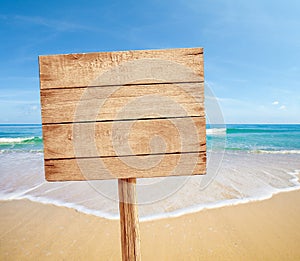 Wood sign on sea beach