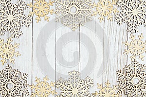 Wood snowflakes on weathered whitewash textured wood background