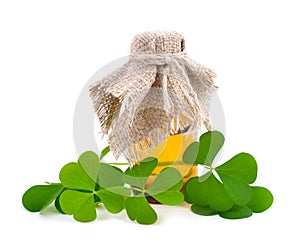 Wood-sorrel leawes with pharmaceutical bottle.