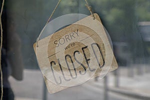 Wood sorry we are closed sign board wooden vintage board on windows shop restaurant cafe store signboard