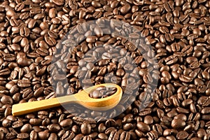 Wood spoon on coffee beans