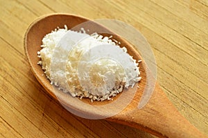 Wood spoon and desiccated coconut