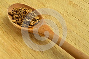 Wood spoon and granules coffee