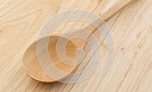 Wood spoon on wood background
