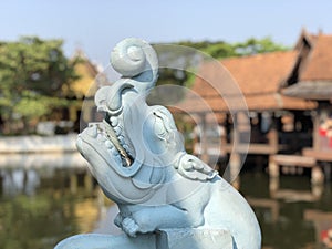 Wood statue at the floating market