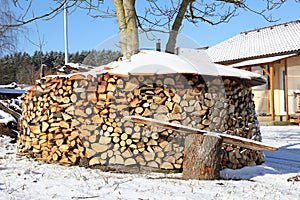 Wood stock in front of family house