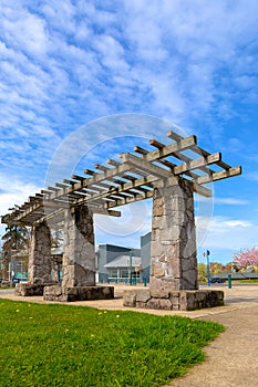 Wood and Stone Pergola Structure in City Park