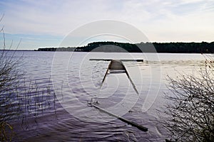 Wood submerged pontoon by water storm jetty in lake Carcans Maubuisson  France