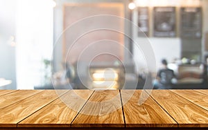 Wood table in blur background of modern restaurant