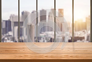 Wood table in city center modern office background