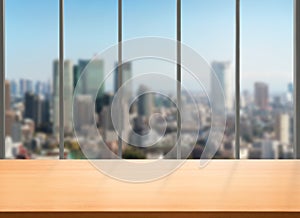 Wood table in city center modern office background