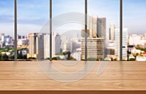 Wood table in city center modern office background