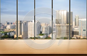 Wood table in city center modern office background