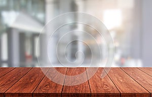 Wood table in city center modern office background photo