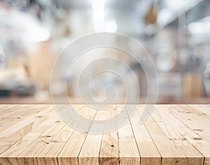 Wood table,counter island on blur kitchen room background.For montage product display or design key visual