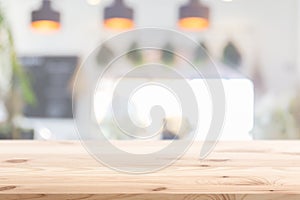 Wood table foreground with blur home cafe kitchen background