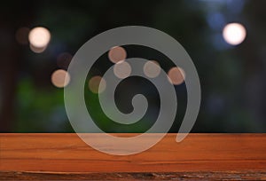 Wood table in front of cafe light