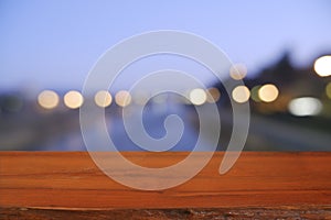 Wood table in front of outdoor evening sky