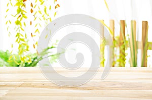 Wood table with garden background