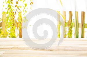 Wood table with garden background