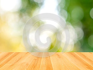Wood table and green bokeh nature background