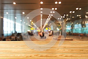 Wood table in large conference hall background
