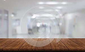 Wood table in modern hospital building interior