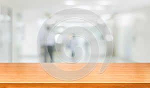 Wood table in modern hospital building interior.