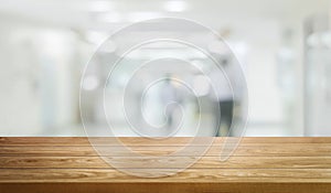 Wood table in modern hospital building interior.