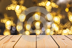 Wood table perspective top on shiny warm light bokeh background