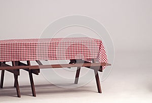 Wood table and red napkin for outdoor party.