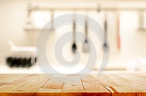 Wood table top (as kitchen island) on blur kitchen background