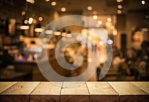 Wood table top Bar with blur light bokeh in dark night