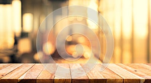 Wood table top Bar with blur light bokeh in dark night cafe,restaurant