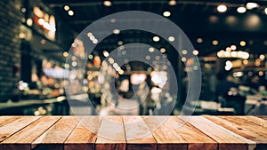 Wood table top Bar with blur light bokeh in dark night cafe,restaurant background